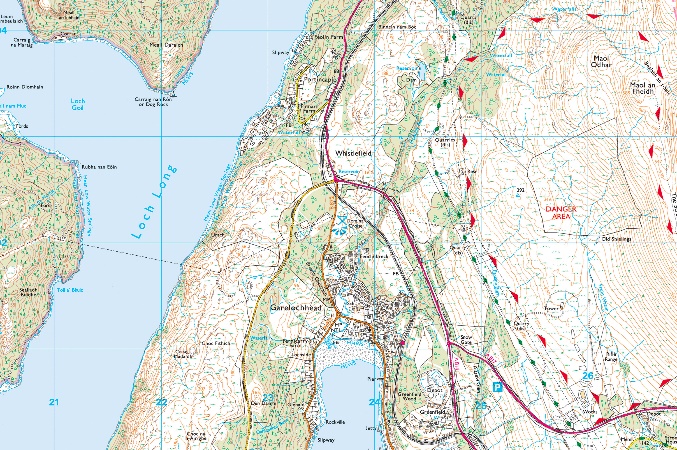 Close-up of a hiking map highlighting the coastline, roads, and a Danger Area sign in the Scottish mountains